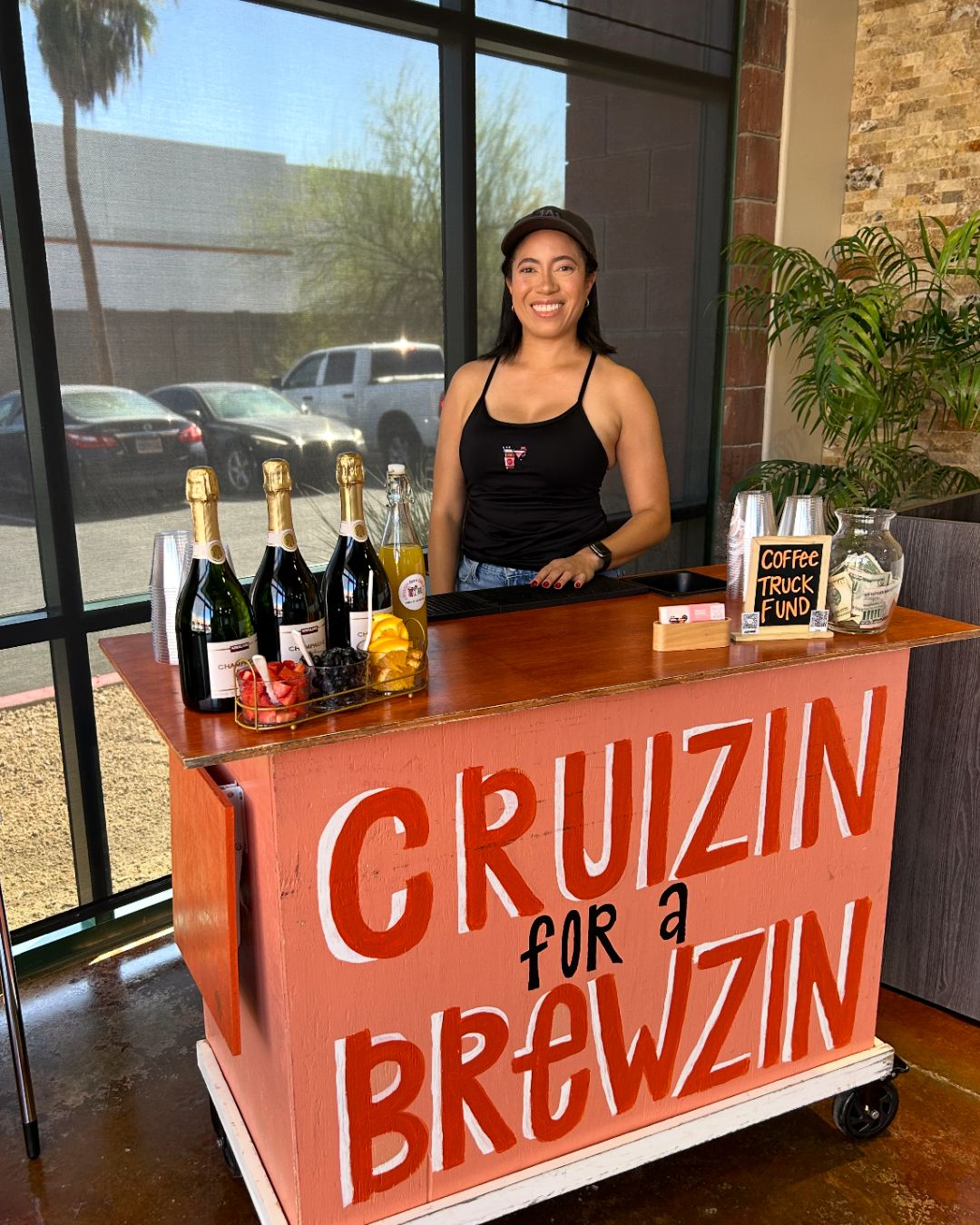 Bartender with champagne and fresh fruit setup